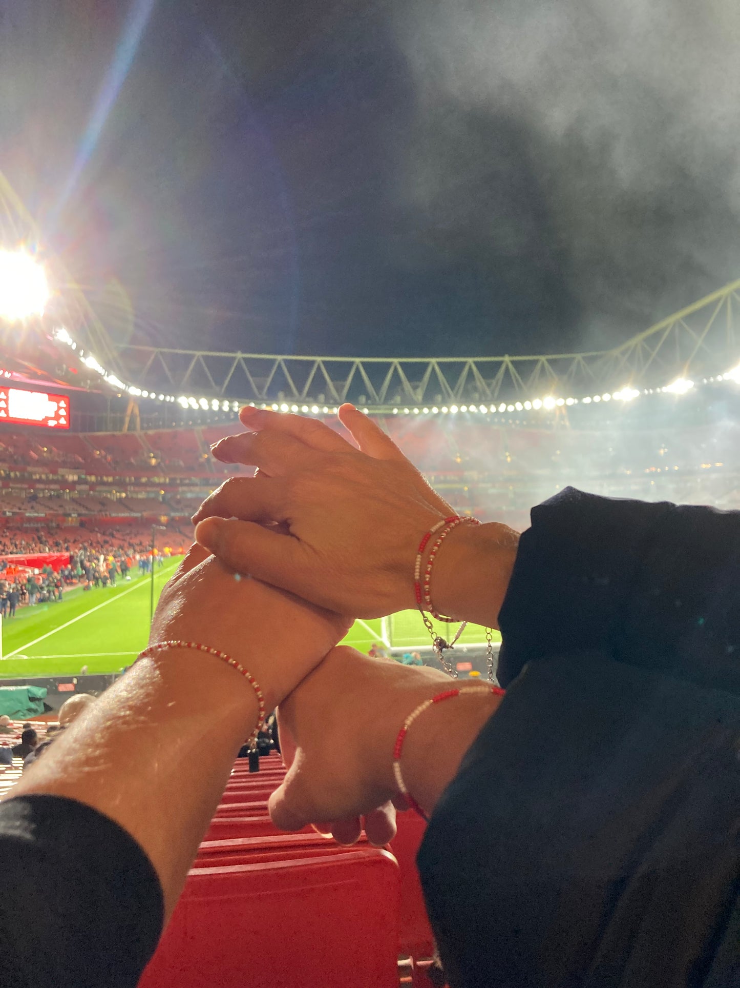 Football fans with bracelets